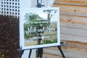 A mirror sign with a welcome message for weddings